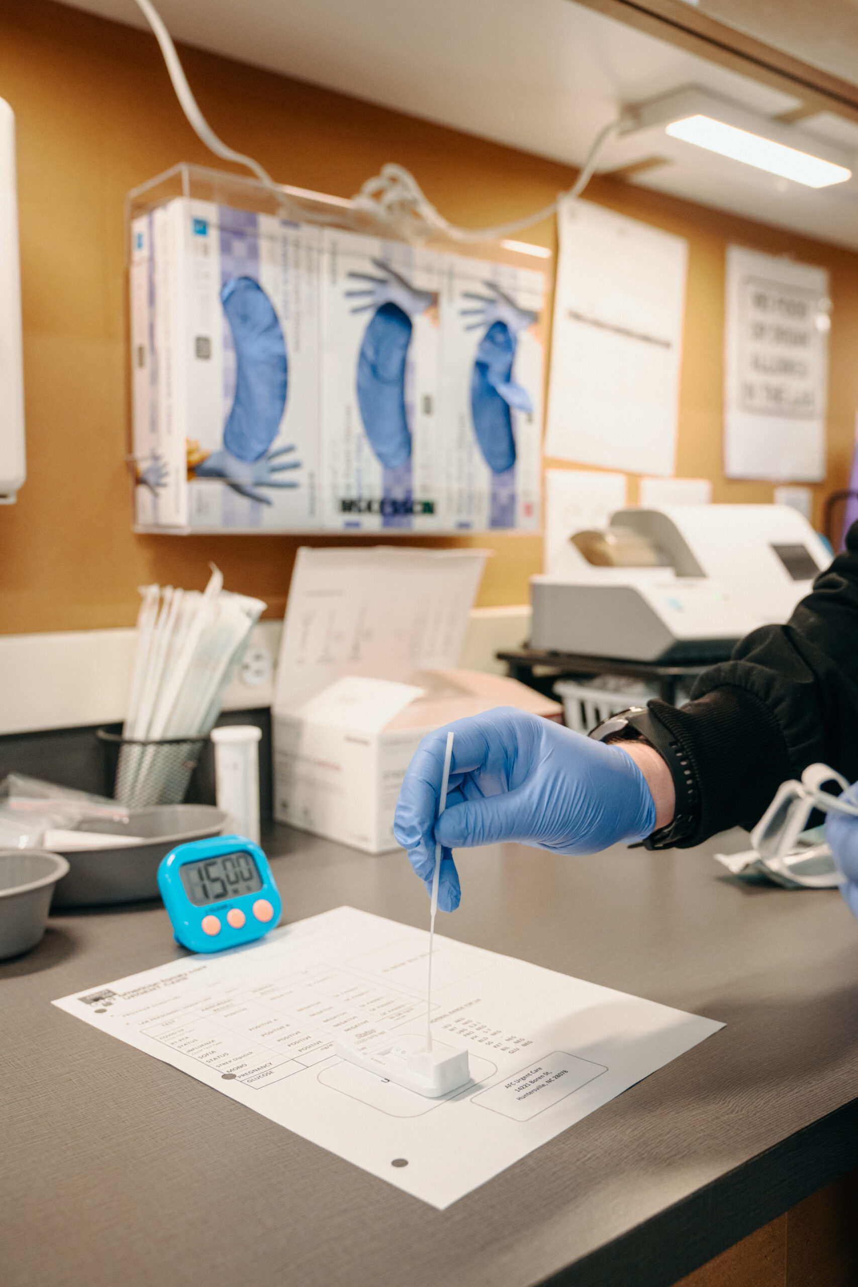 AFC Urgent Care medical professional doing a rapid test.