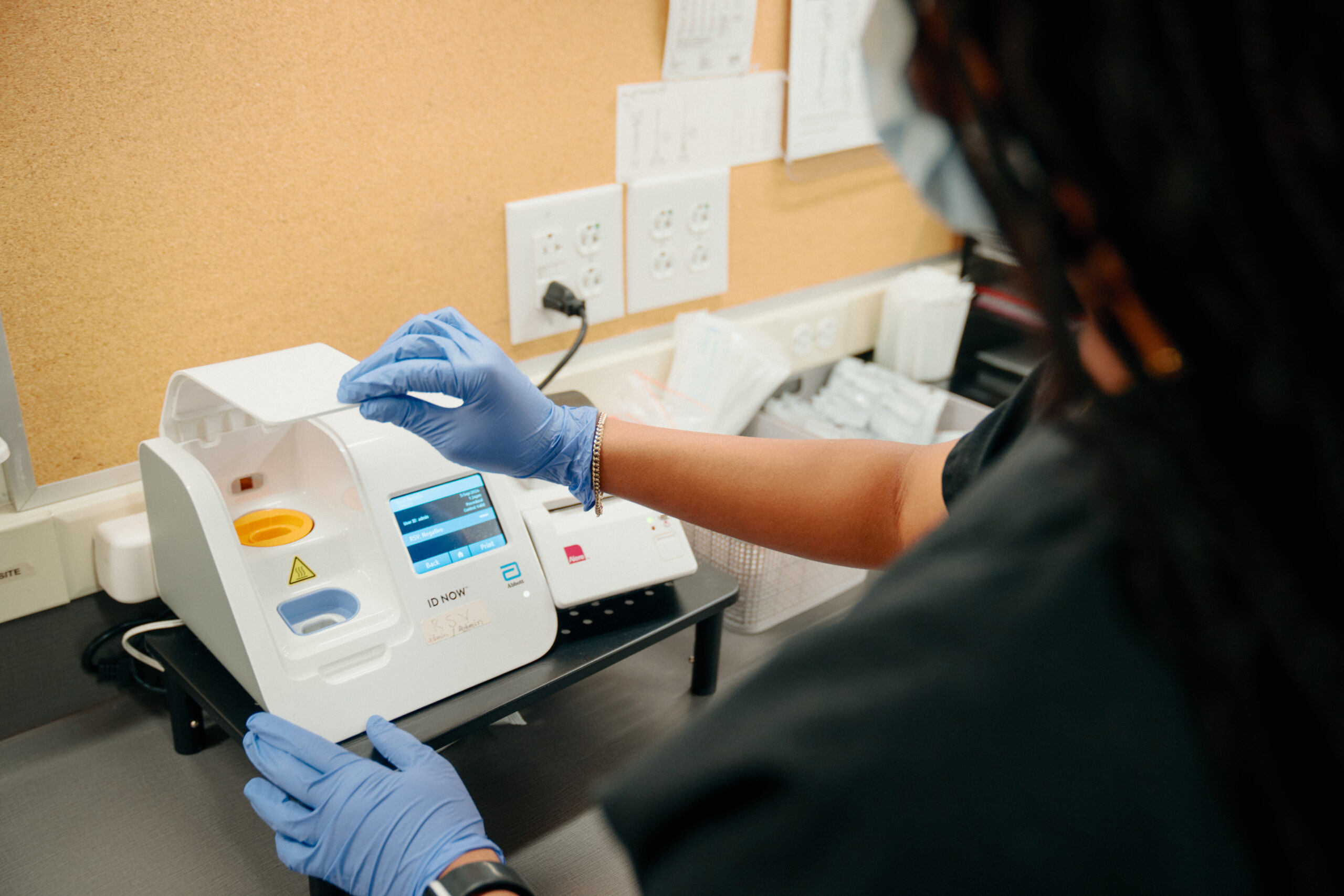 AFC Urgent Care medical professional doing a rapid RSV rapid test.